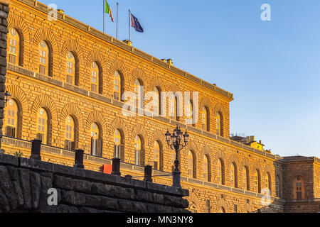Golden sunlight hit the facade of Palazzo Pitti (Pitti Palace) in Florence, Italy at sunset Stock Photo