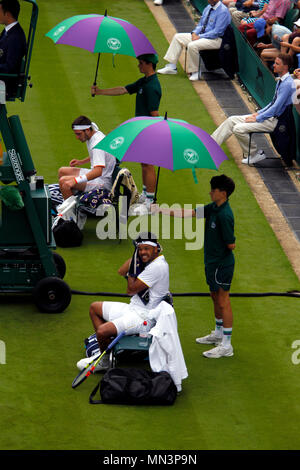 London, 3 July, 2017:  Jo-Wifried Tsonga of France and Cameron Norrie on a changeover during their first round match at Wimbledon. Stock Photo