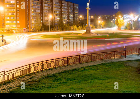 Los Angeles at night. Long exposure shot of blurred bus speeding through night street. Stock Photo