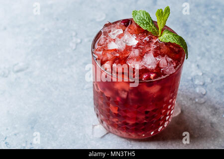 Pomegranate Cocktail with Mint Leaves and Crushed Ice. Beverage Concept. Stock Photo