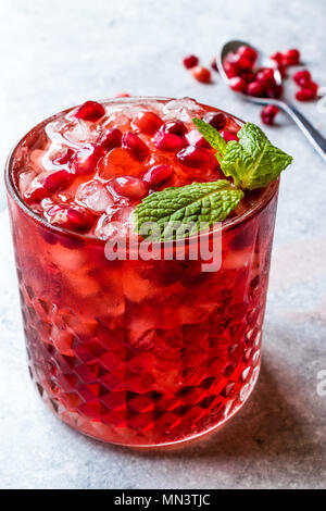 Pomegranate Cocktail with Mint Leaves and Crushed Ice. Beverage Concept. Stock Photo