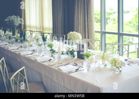 Wedding reception table set with flower Stock Photo