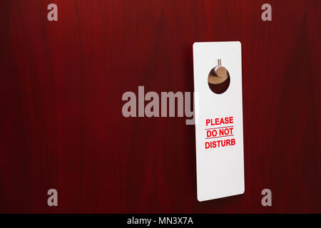 Hotel door with sign please do not disturb Stock Photo