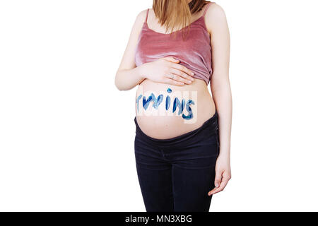 Close-up belly of pregnant woman. Gender: boy, girl, twins. Stock Photo