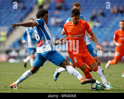 Barcelona, 13th May: Carlos Sanchez of RCD in action with Adrian Gonzalez of Malaga CF