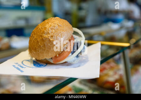 11 May 2018, Germany, Hamburg: A 'Matjesbroetchen' ('soused herring sandwich') on the second day of Hamburg Port's 829th Anniversary. The festival will last until 13 May 2018. Photo: Markus Scholz/dpa Stock Photo