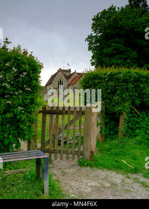 Spring time view on an overcast day from the north gate leading from the Lythes footpath of St Mary's church, Selborne, Hampshire, UK Stock Photo