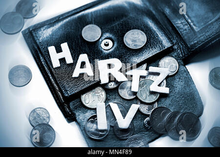 Wallet with small money and lettering Hartz IV, Portemonnaie mit Kleingeld und Schriftzug Hartz IV Stock Photo