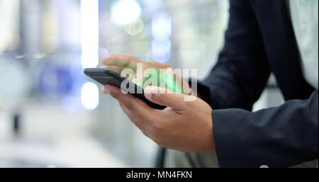 Businessman asian using phone for celling and texting on her mobile phone Stock Photo