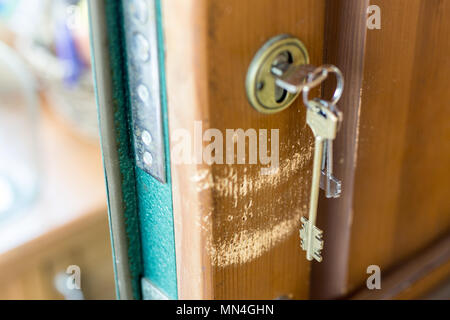 Lock and keys. Closeup of opened metal padlock with key inside isolated on  a white background. Macro photograph of metal lock with keys Stock Photo -  Alamy