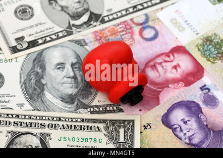 Boxing gloves on dollar bills and Chinese renminbi, impending trade war between the US and China, Boxhandschuh auf Dollarnoten und chinesischen Renmin Stock Photo