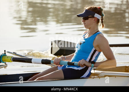 Determined female rower rowing scull Stock Photo