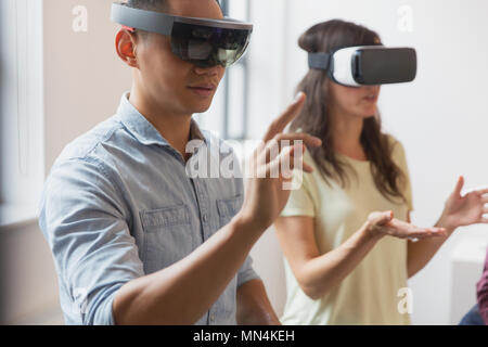 Computer programmers testing virtual reality simulator glasses Stock Photo