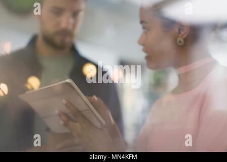 Businessman and businesswoman using digital tablet Stock Photo