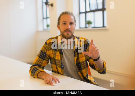 Portrait creative businessman using computer in office Stock Photo