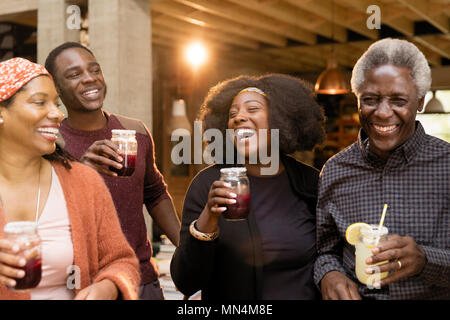 Happy multi-generation family drinking lemonade and sangria Stock Photo