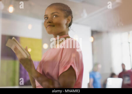 Confident businesswoman using digital tablet in office Stock Photo