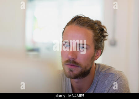 Focused creative businessman working at laptop Stock Photo