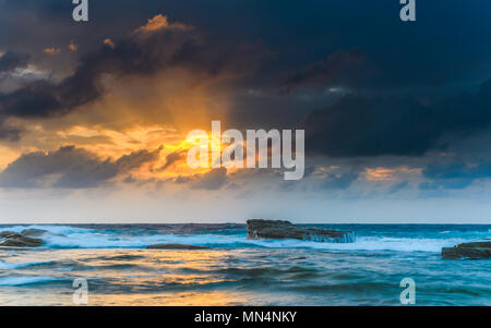 Capturing the sunrise from The Skillion at Terrigal on the Central Coast, NSW, Australia. Stock Photo