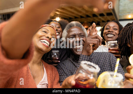 Happy multi-generation family posing for selfie Stock Photo