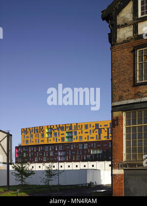 Side elevation in context. Chips, Manchester, United Kingdom. Architect: Alsop, 2012. Stock Photo