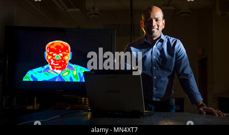 Dr. Wellesley Pereira, a senior research physical scientist with the Air Force Research Lab's (AFRL) Space Vehicles Directorate at Kirtland Air Force Base, N.M. Pereira currently researches hyper-spectral imaging, but his experience in astronomy and physics has led him to theorize that the Air Force may push the envelope of manned space exploration by employing ground-based laser arrays fired at spacecraft deploying sails to transfer the momentum of photons to the craft propelling it through space. (U.S. Air Force photo/J.M. Eddins Jr.) Stock Photo