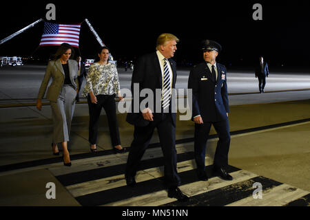 President of the United States Donald J. Trump and First Lady Melania Trump walks with Col. Casey D. Eaton, 89th Airlift Wing commander and his wife Lisa Eaton at Joint Base Andrews, Md., May 10, 2018 as they prepare to greet three Americans who were freed from North Korea on May 9, 2018. An 89th AW C-40 high-priority personnel transport aircraft carried Kim Dong-chul, Tony Kim and Kim Hak-song from North Korea to Anchorage, Alaska where the plane refueled before arriving at JBA at 3 a.m. EST. The 89th AW executes special missions such as these on a routine basis while enabling national intere Stock Photo