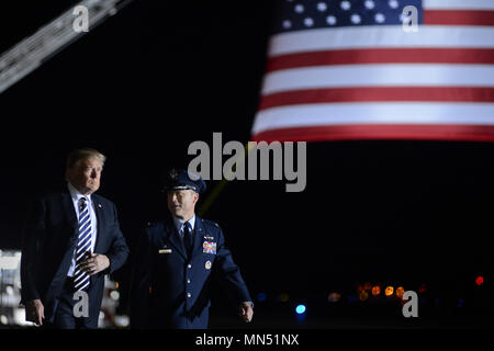 President of the United States Donald J. Trump walks with Col. Casey D. Eaton, 89th Airlift Wing commander at Joint Base Andrews, Md., May 10, 2018 as they prepare to greet three Americans who were freed from North Korea on May 9, 2018. An 89th AW C-40 high-priority personnel transport aircraft carried Kim Dong-chul, Tony Kim and Kim Hak-song from North Korea to Anchorage, Alaska where the plane refueled before arriving at JBA at 3 a.m. EST. The 89th AW executes special missions such as these on a routine basis while enabling national interests through global transportation for America's senio Stock Photo