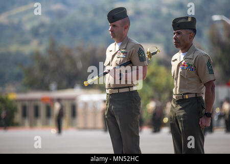 Sgt. Maj. Travis L. Debarr, the outgoing battalion sergeant major, and ...