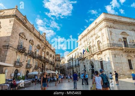 Siracusa, Italy - August 17, 2017: Piazza Duomo and the cathedral with people around in the old town in Siracusa, Sicily, Italy Stock Photo