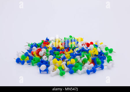 Pile of plastic notice board push pins on a white background Stock Photo