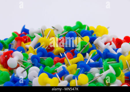 Pile of plastic notice board push pins on a white background Stock Photo