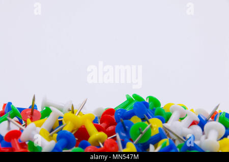 Pile of plastic notice board push pins on a white background Stock Photo