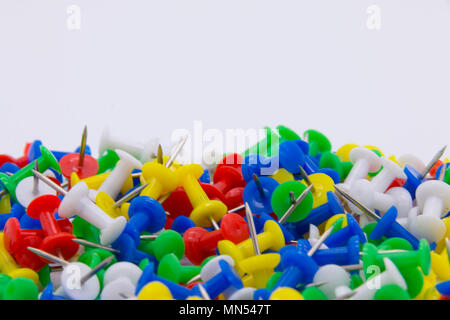 Pile of plastic notice board push pins on a white background Stock Photo