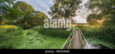 Sunrise from the footbridge over a the River Stour at Sturminster Mill, Sturminster Newton, Dorset, England, UK Stock Photo