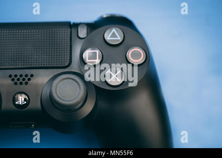 LONDON - MAY 03, 2018: Video games PlayStation gaming controller on wood background Stock Photo