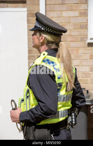 Portrait of a uniformed police officer holding handcuffs Stock Photo ...