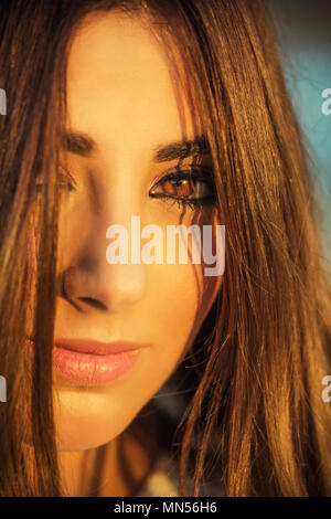 Close up portrait of a beautiful young woman outdoors Stock Photo