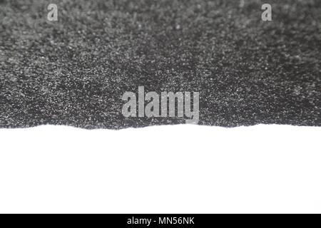 Torn White Paper on Rough Dark Textured background Stock Photo