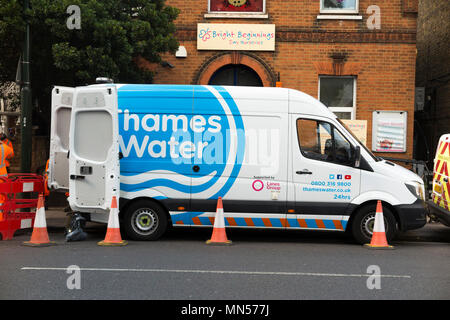 Thames water lorry / van / vans / vehicles at the site of a blocked pipe / drain / drainage / sewer blockage attended by their staff and workers in Twickenham, West London. UK (96) Stock Photo