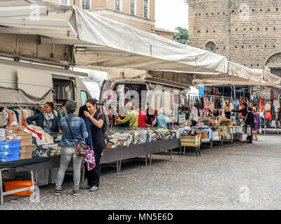 Ladies chatting by Italian market stall Stock Photo