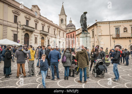 Town people gathered around statue of Ovid at Piazza XX Settembre on Easter Sunday in Sulmona, Abruzzo, Italy Stock Photo