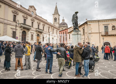 Town people gathered around statue of Ovid at Piazza XX Settembre on Easter Sunday in Sulmona, Abruzzo, Italy Stock Photo