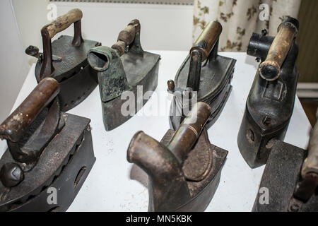 The photo shows an old iron, an old iron for ironing clothes Stock Photo