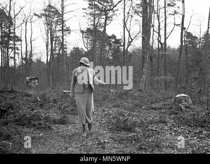 Elegantly dressed lady walking in the Black Forest in Germany 1934 Stock Photo