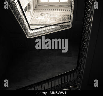 Osborne House, East Cowes, Isle of Wight, Looking up the middle of the staircase onto top landing in monochrome Stock Photo