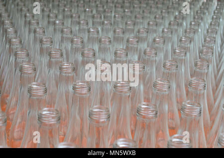 Many empty translucent bottles in a row are perspective Stock Photo