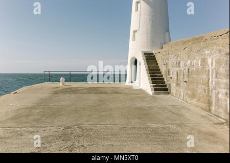 Lighthouse in Macduff harbour, Scotland. Stock Photo