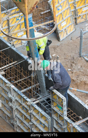 concrete placement in framed formwork Stock Photo