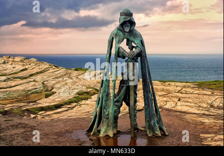 Tintagel, Cornwall, UK - April 10 2018: The King Arthur statue Gallos by Rubin Eynon stands on a rocky headland on the Atlantic coast of Cornwall. Stock Photo